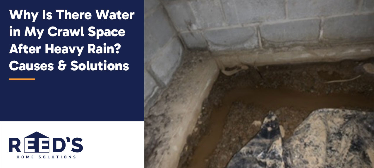 Standing water in a crawl space after heavy rain beside a concrete block foundation, showing drainage and moisture intrusion issues.