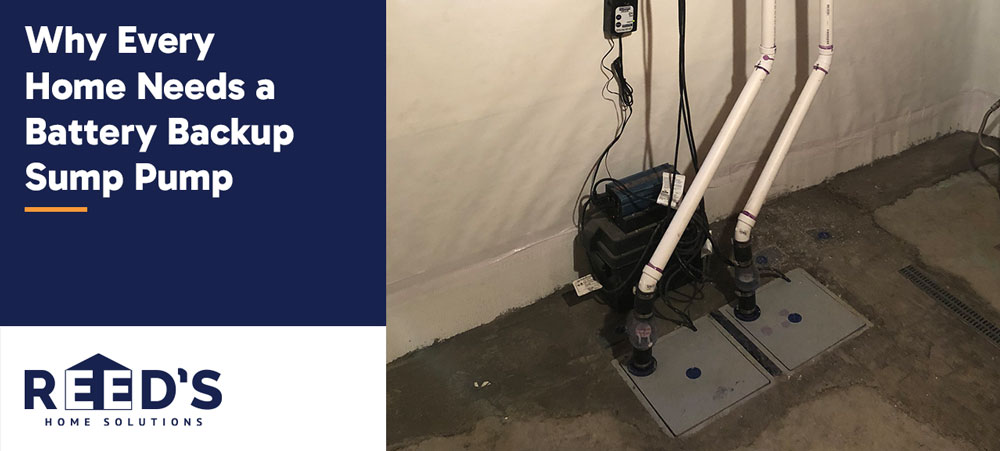 Battery backup sump pump system installed in a basement with dual discharge pipes to protect against flooding during power outages