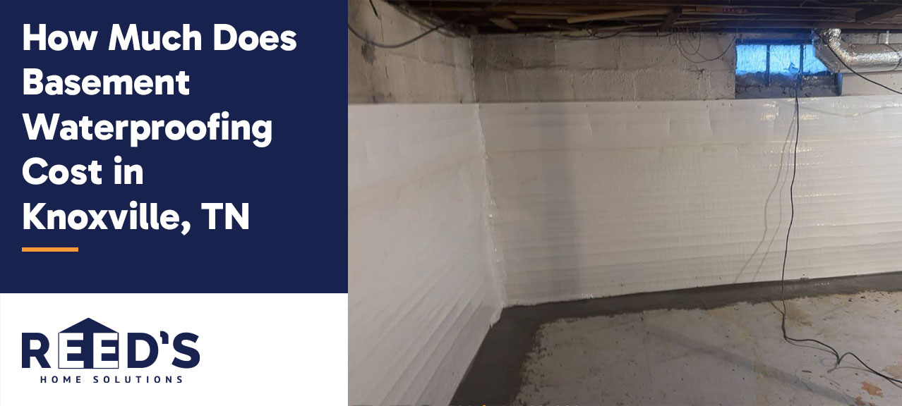 Basement interior with white waterproofing panels installed along concrete walls, featuring a clean sealed perimeter and exposed ceiling in a Knoxville, TN home.