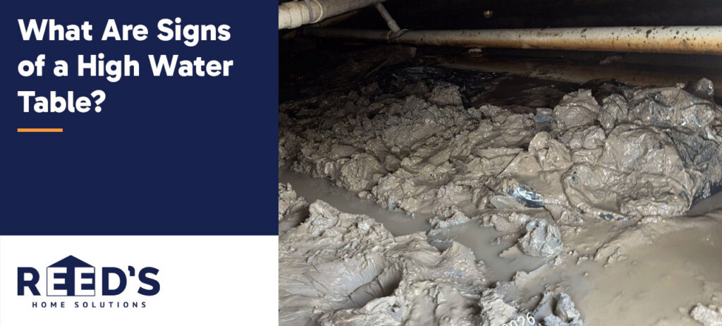 Waterlogged crawl space with standing water, saturated soil, and damaged vapor barrier, illustrating a common sign of a high groundwater table beneath a home.